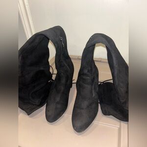 Knee high black heeled boots